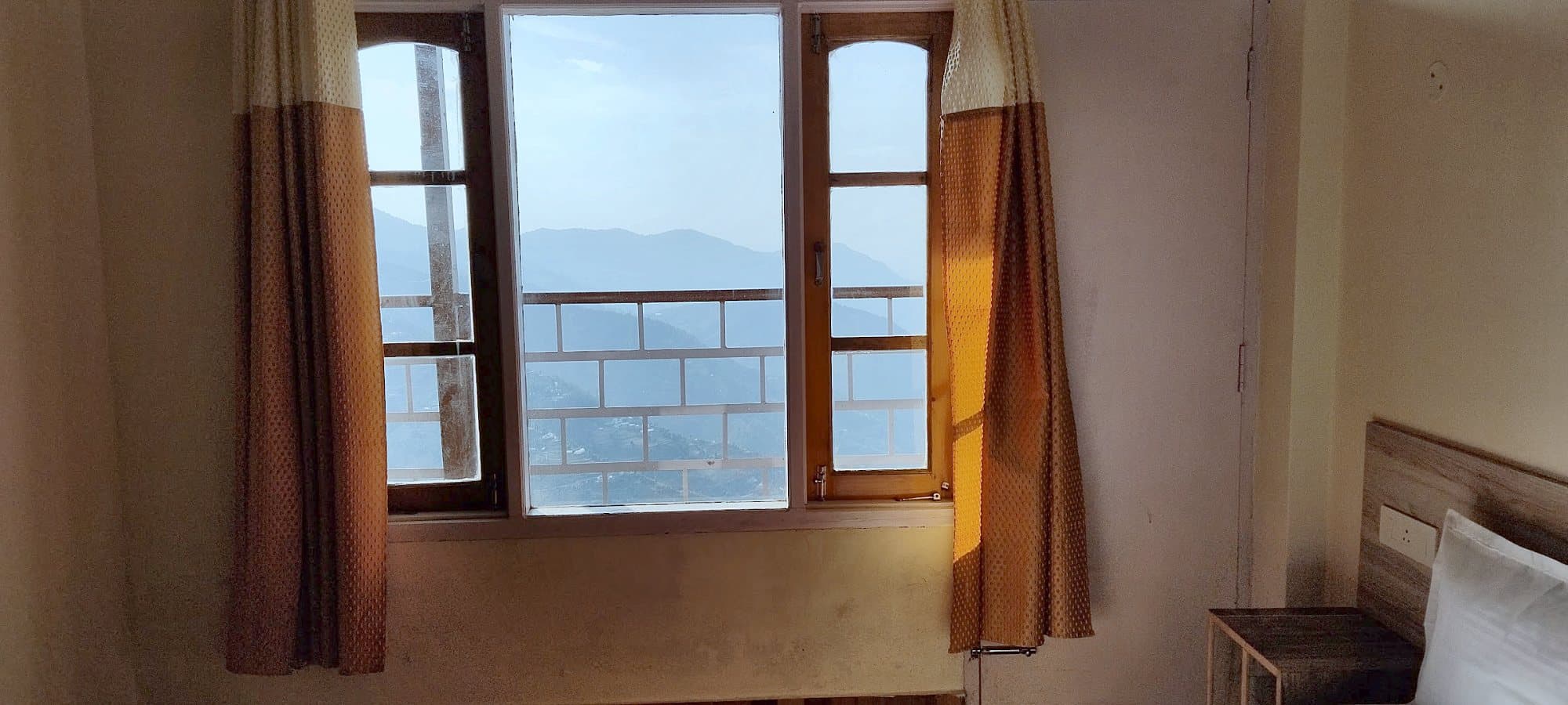 Bedroom window at Pinewood with the hills visible outside
