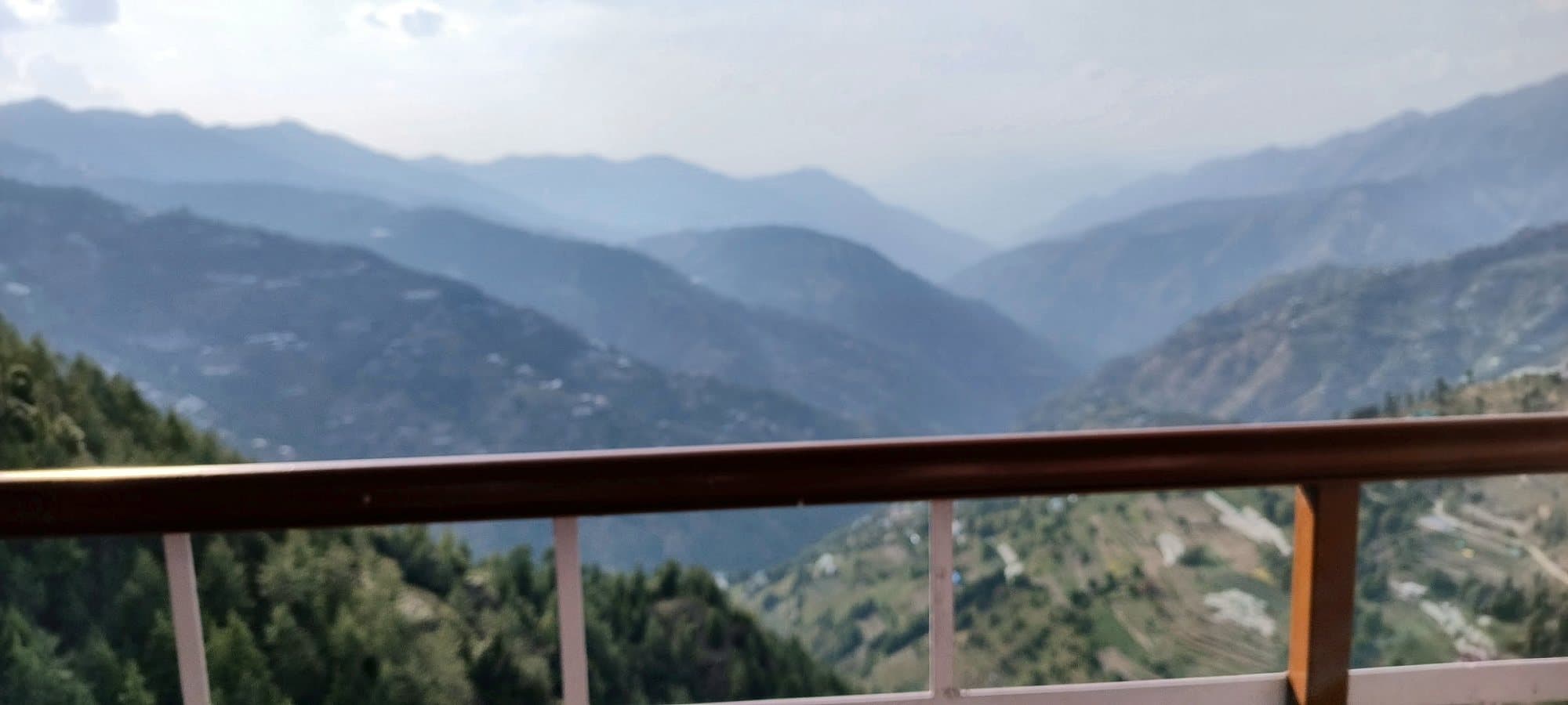 View of the hills and valley over the balcony railing at Pinewood